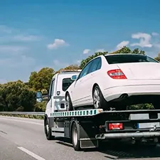 Car being transported on a recovery truck