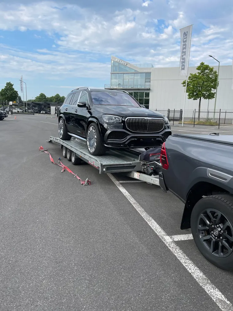 Mercedes secured on a car transport trailer